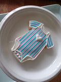 blue and pink striped gender reveal cookies by 23sweets.com with gender reveal colour inside