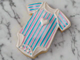blue and pink striped gender reveal cookies by 23sweets.com with gender reveal colour inside