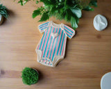 blue and pink striped gender reveal cookies by 23sweets.com with gender reveal colour inside