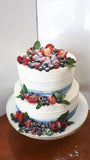 CYNTHIA’s WEDDING CAKE, 2 tier cake with custard filling and topped with fresh fruit.