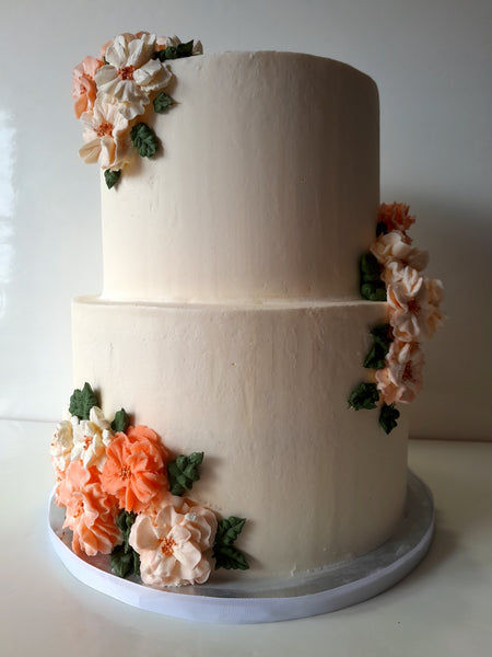 WEDDING CAKE 2 tier classic buttercream wedding cakes, peach coloured floral design elegant simple, 8 and 10 inch round tiers