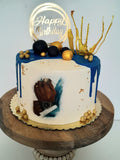 Custom masculine themed 8 inch round cake, fondant motifs cake, with topper