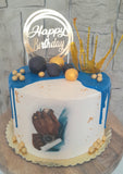 Custom masculine themed 8 inch round cake, fondant motifs cake, with topper