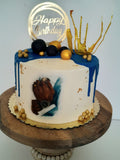Custom masculine themed 8 inch round cake, fondant motifs cake, with topper