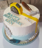 Cake with tools and 'Happy Birthday Felix' text on a white background