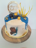Custom masculine themed 8 inch round cake, fondant motifs cake, with topper