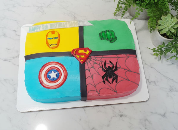 Superhero-themed birthday cake with Iron Man, Hulk, Superman, Captain America, and Spider-Man designs.
