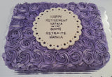 Purple frosted cake with a Retirement message on a white background