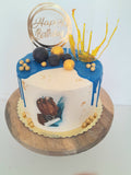 Custom masculine themed 8 inch round cake, fondant motifs cake, with topper