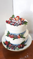 WEDDING CAKE, 2 tier cake with custard filling and topped with fresh fruit.