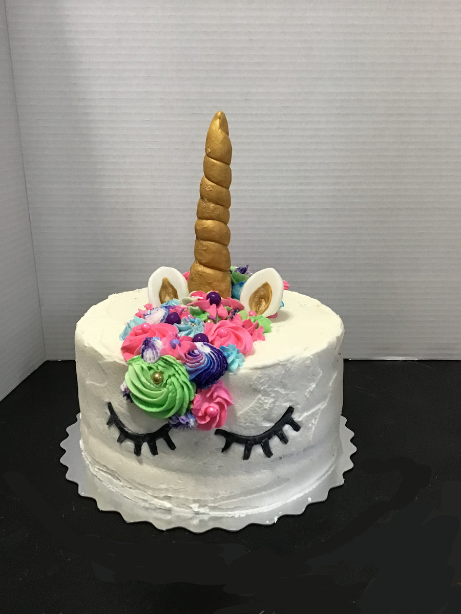 Unicorn Cake with Rainbow Theme by Creme Castle